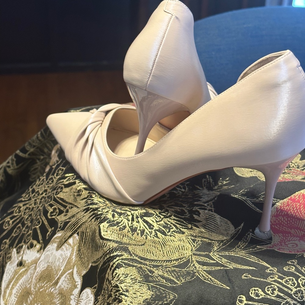 Cream tint high heels with a crystal like heel tap.
